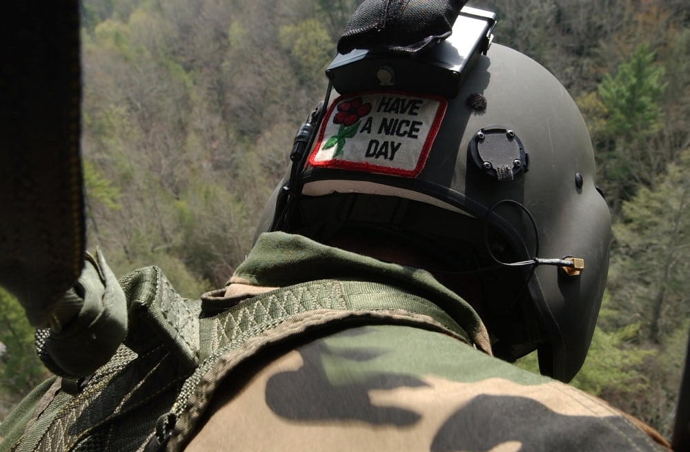 A US Army National Guardsman looks out a UH-60 Black Hawk Canvas Art - Stocktrek Images (34 x 23)