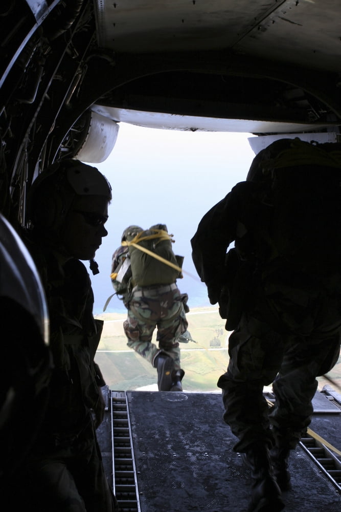 A US Army Soldier performs a static-line jump from a CH-46E Sea Knight Canvas Art - Stocktrek Images (23 x 34)
