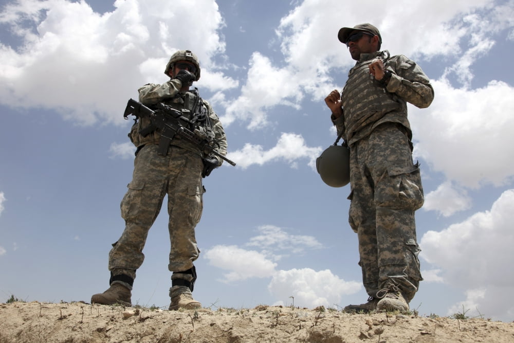 A US Army soldier communicates with his platoon by radio Canvas Art - Stocktrek Images (34 x 23)
