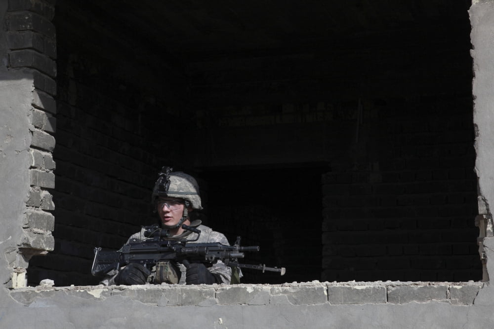 A US Army soldier provides security at a construction building in Iraq Canvas Art - Stocktrek Images (34 x 23)