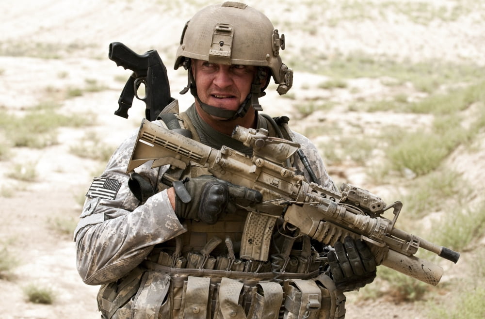 A US Army soldier secures the perimeter of a village in Afghanistan Canvas Art - Stocktrek Images (34 x 23)