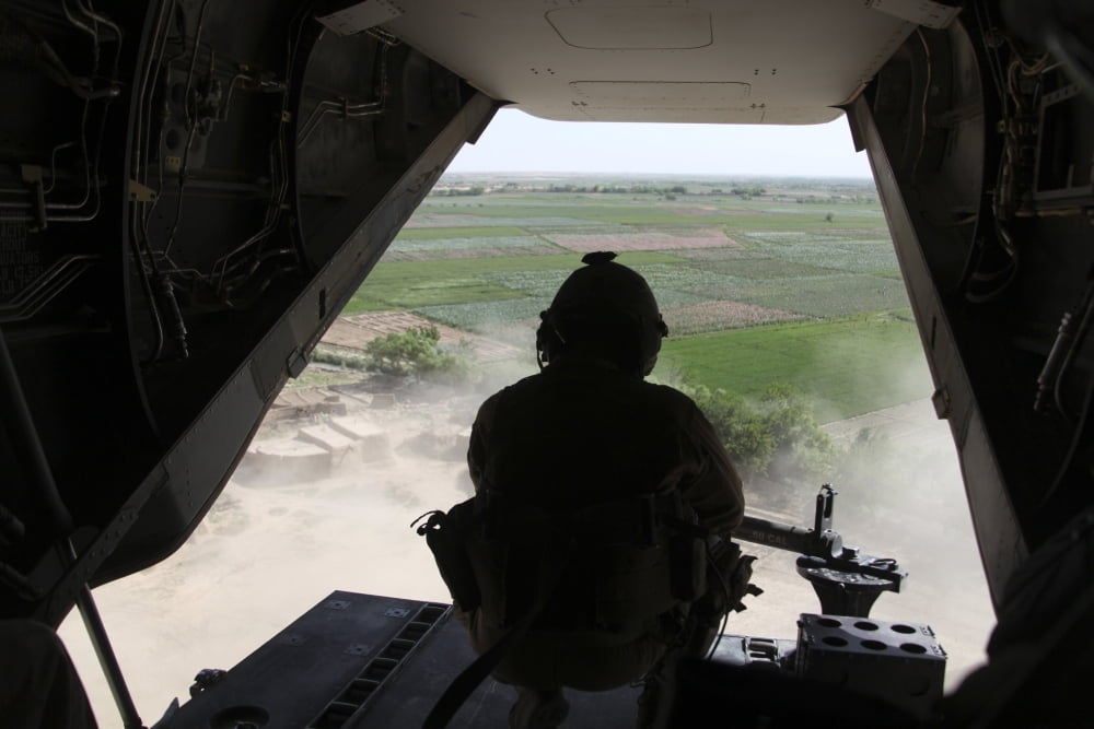 A US Marine Corps door gunner aboard an MV-22 Osprey Canvas Art - Stocktrek Images (35 x 23)