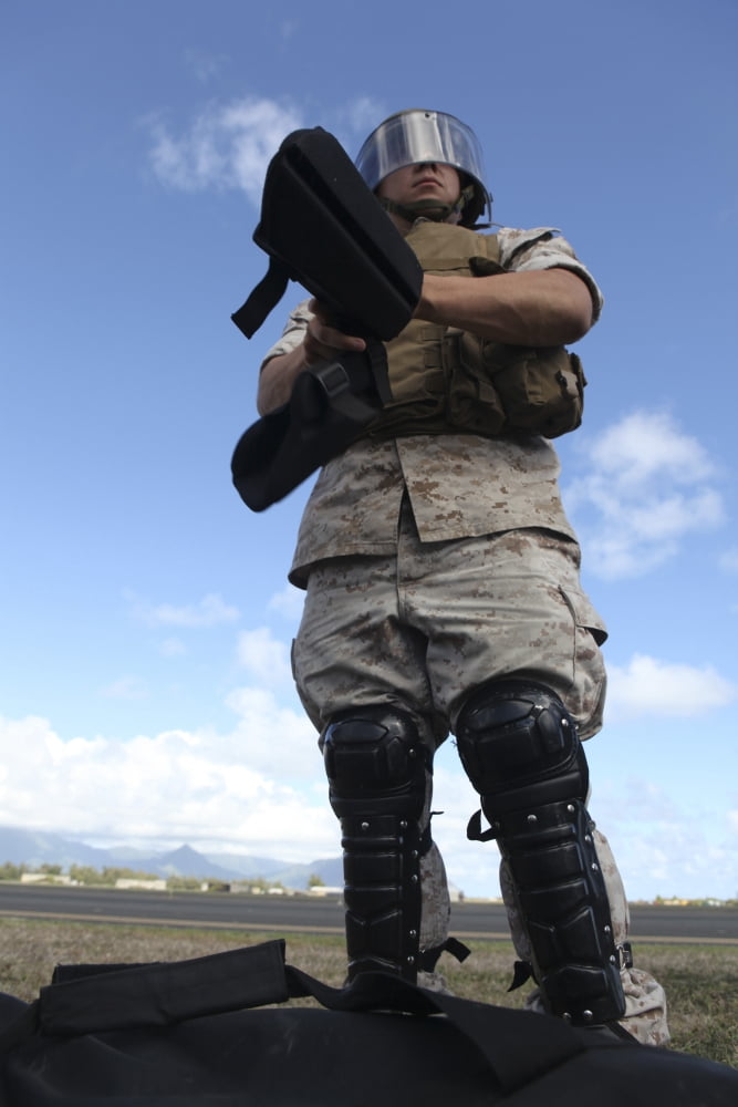 A US Marine dons riot gear for drills during Exercise Lethal Breeze Canvas Art - Stocktrek Images (23 x 34)