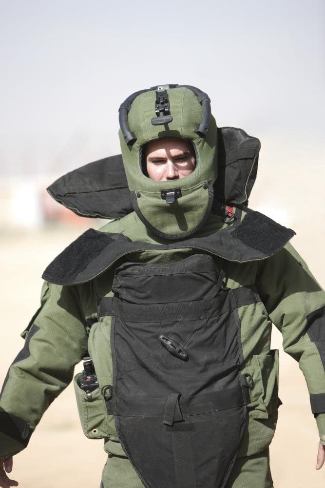 A US Marine gets suited up into a bomb suit Canvas Art - Terry MooreStocktrek Images (24 x 35)