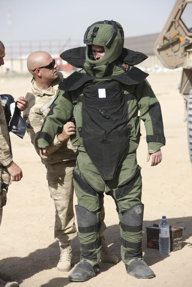 A US Marine gets suited up into a bomb suit Canvas Art - Terry MooreStocktrek Images (24 x 35)