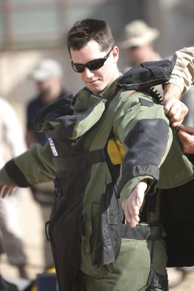 A US Marine gets suited up into a bomb suit Canvas Art - Terry MooreStocktrek Images (24 x 35)