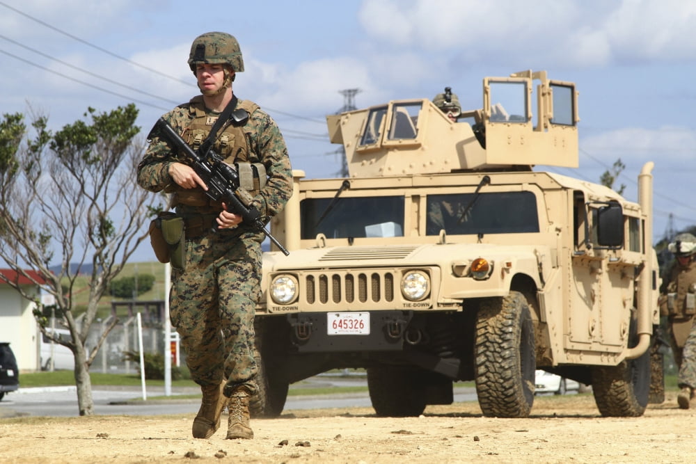 A US Marine guides a Humvee through an entry control point in Japan Canvas Art - Stocktrek Images (35 x 23)