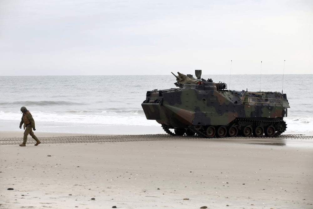 A US Marine guides an amphibious assault vehicle on Onslow Beach Canvas Art - Stocktrek Images (35 x 23)