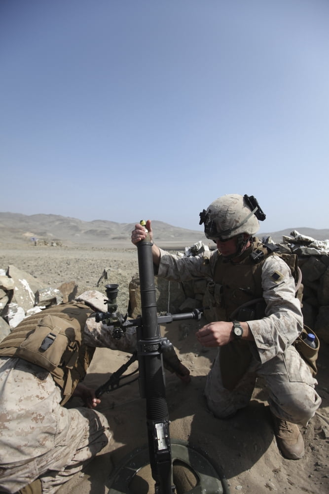 A US Marine loads a mortar into a mortar tube Canvas Art - Stocktrek Images (23 x 34)