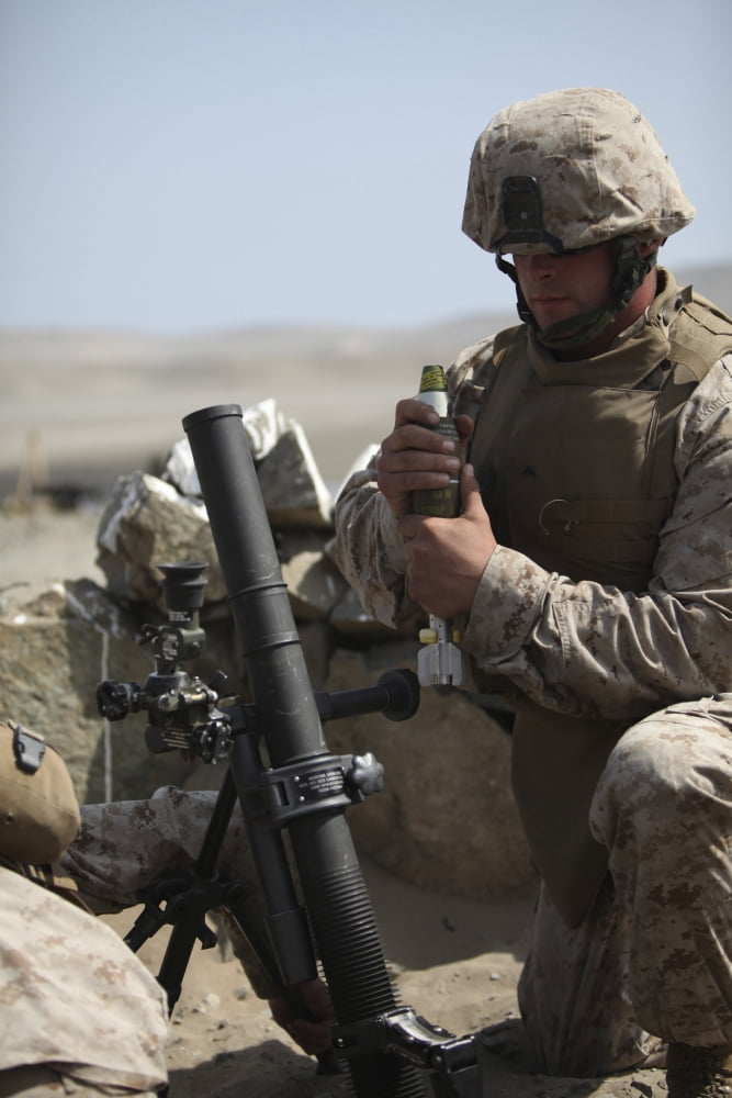 A US Marine loads a mortar into a mortar tube Canvas Art - Stocktrek Images (23 x 34)