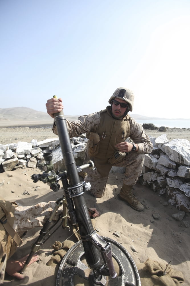 A US Marine loads a mortar into a mortar tube Canvas Art - Stocktrek Images (23 x 34)