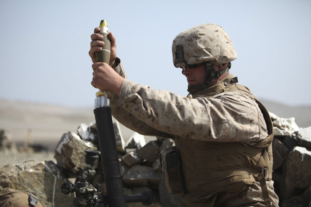 A US Marine loads a mortar into a mortar tube Canvas Art - Stocktrek Images (34 x 23)
