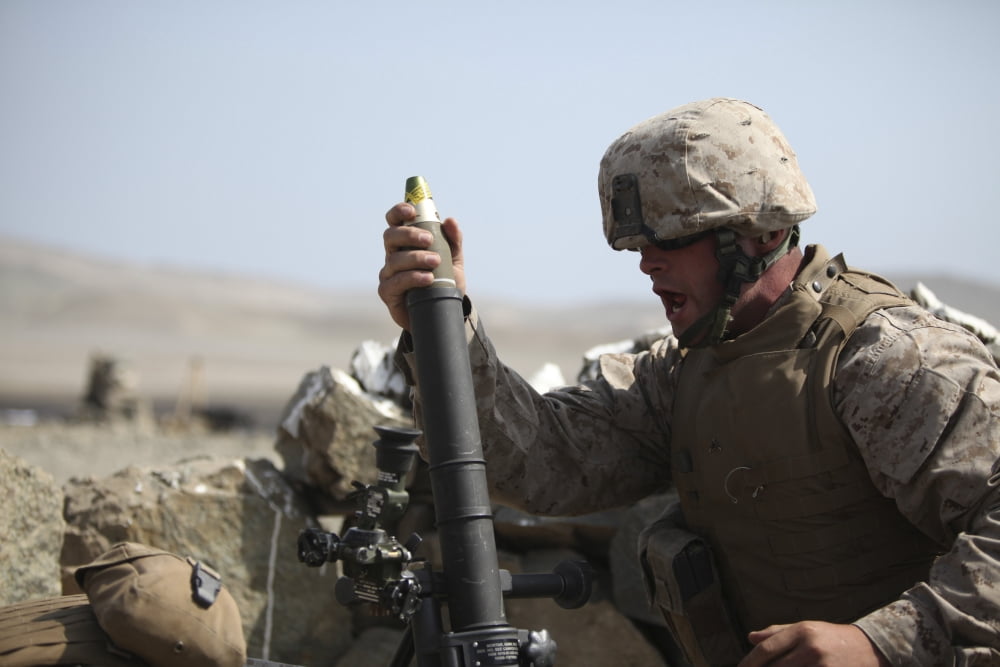 A US Marine loads a mortar into a mortar tube Canvas Art - Stocktrek Images (34 x 23)