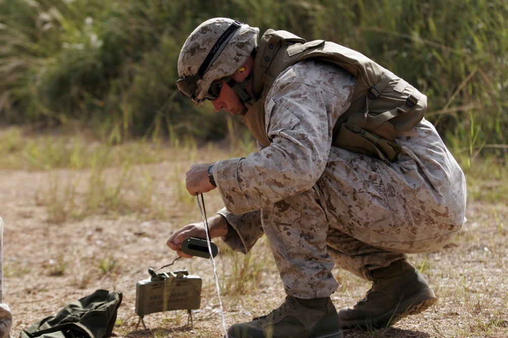 A US Marine places a claymore mine Canvas Art - Stocktrek Images (34 x 23)