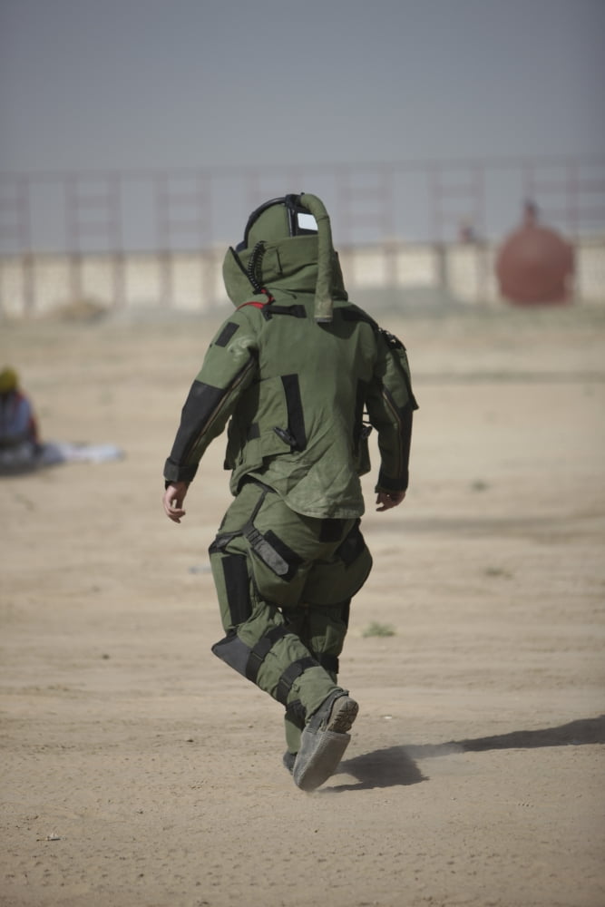 A US Marine tries running in a bomb suit Canvas Art - Terry MooreStocktrek Images (12 x 18)
