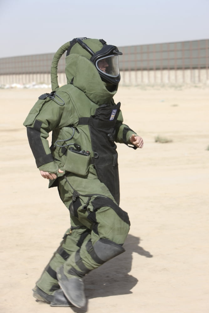 A US Marine tries running in a bomb suit Canvas Art - Terry MooreStocktrek Images (12 x 18)