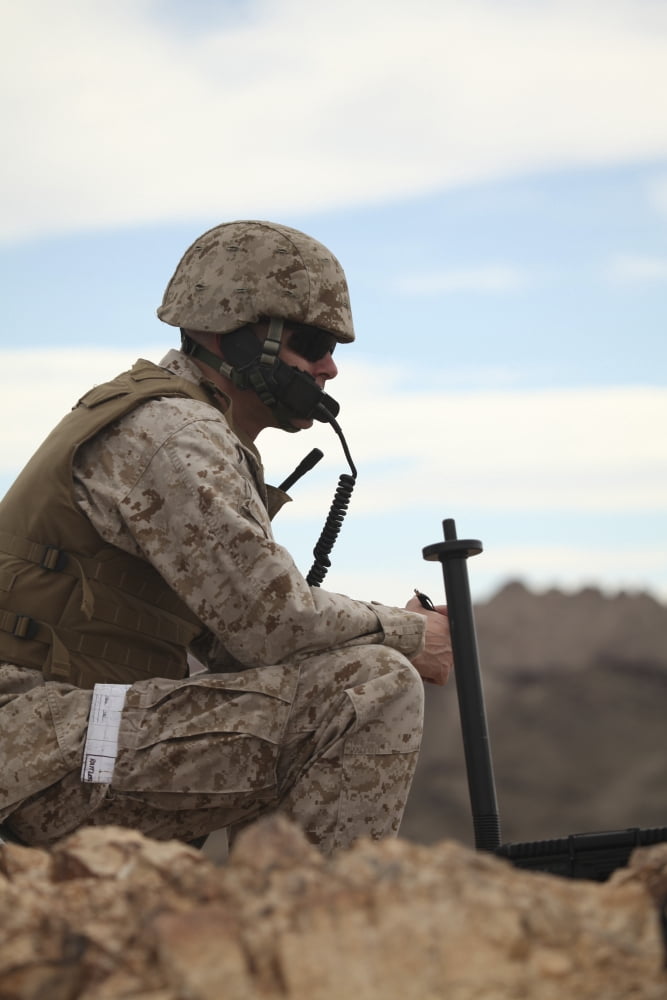 A US Marine uses a field phone to communicate with fellow Marines Canvas Art - Stocktrek Images (24 x 35)