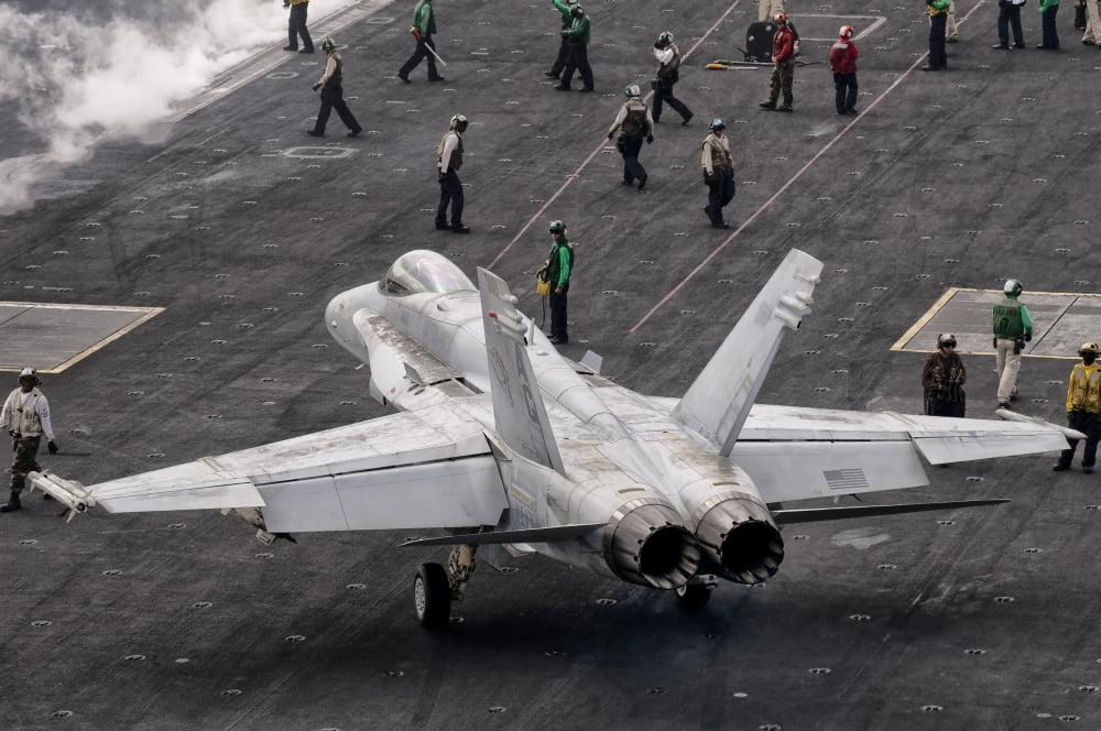 A US Navy FA-18C Hornet on the flight deck of aircraft carrier USS Eisenhower Canvas Art - Giovanni CollaStocktrek Images (18 x 12)