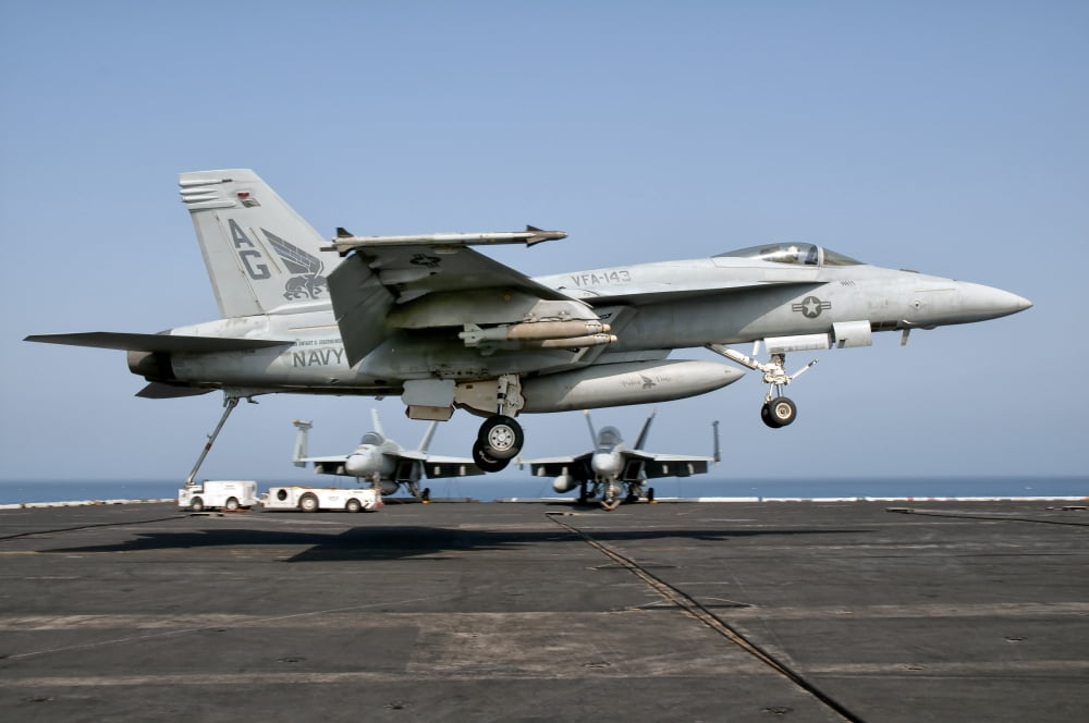 A US Navy FA-18E Super Hornet prepares to land aboard USS Eisenhower Canvas Art - Giovanni CollaStocktrek Images (35 x 24)