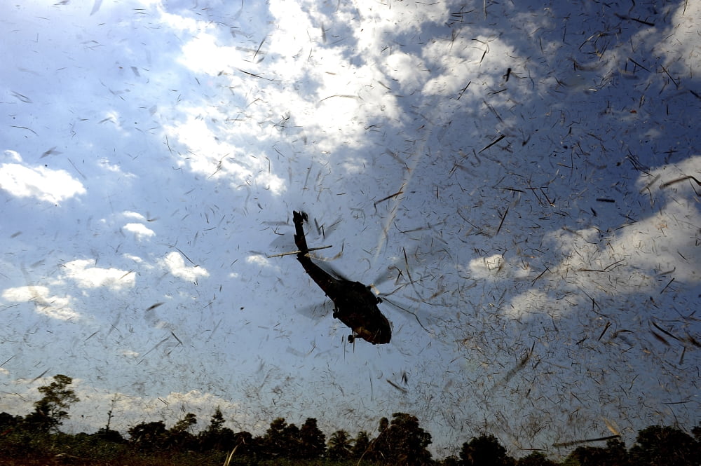 A US Navy HH-60 Seahawk stirs up debris while taking off Canvas Art - Stocktrek Images (34 x 23)