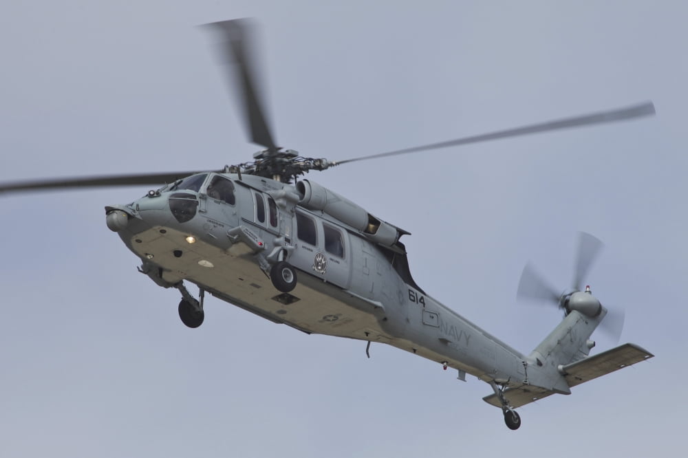 A US Navy MH-60S Seahawk in flight over Coronado California Canvas Art - Timm ZiegenthalerStocktrek Images (35 x 23)