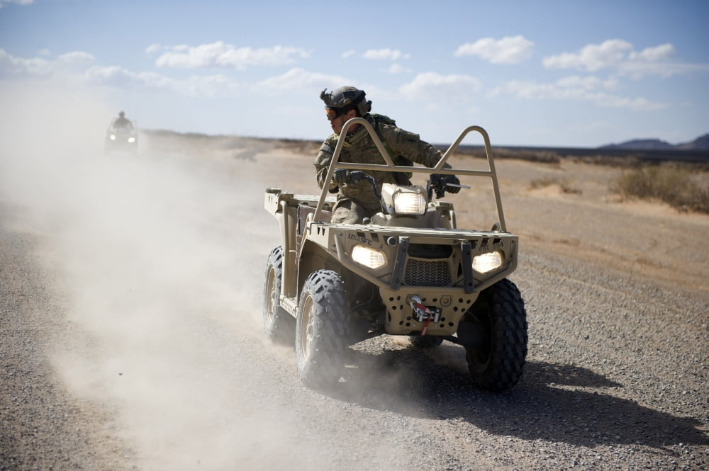 A US Soldier performs off-road maneuvers with a LTATV Canvas Art - Stocktrek Images (34 x 23)