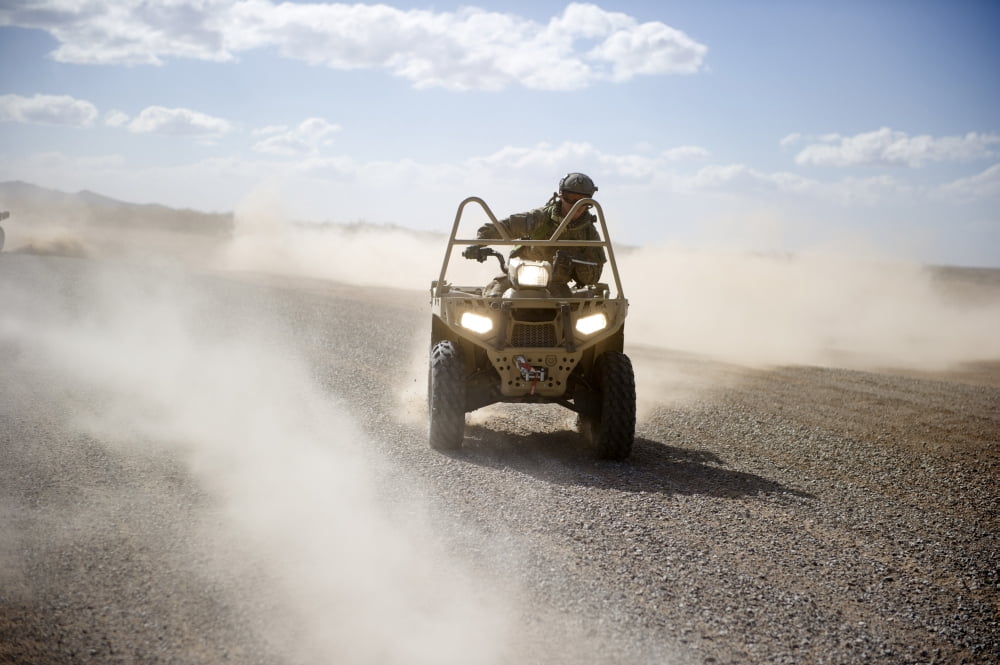 A US Soldier performs off-road maneuvers with a LTATV Canvas Art - Stocktrek Images (34 x 23)