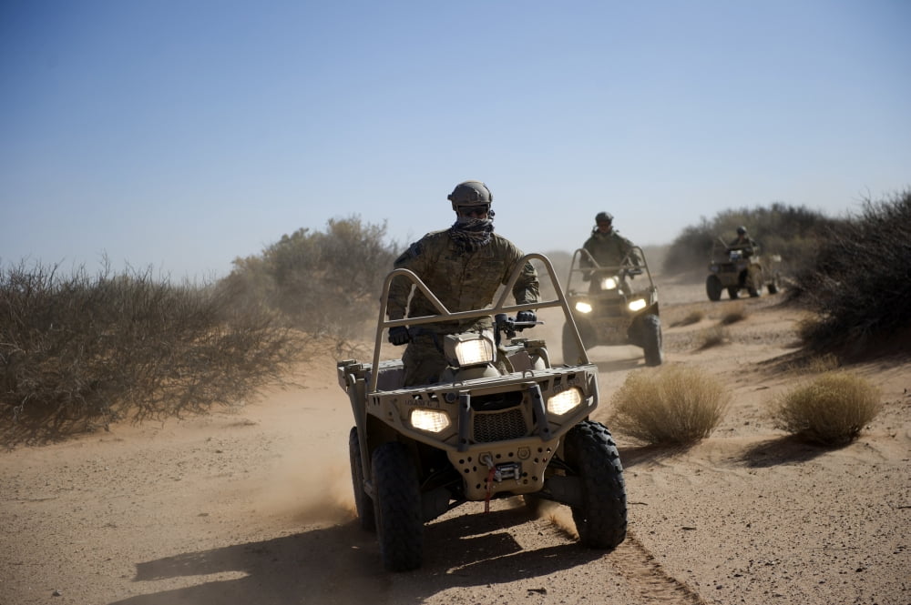 A US Soldier performs off-road maneuvers with a LTATV Canvas Art - Stocktrek Images (34 x 23)