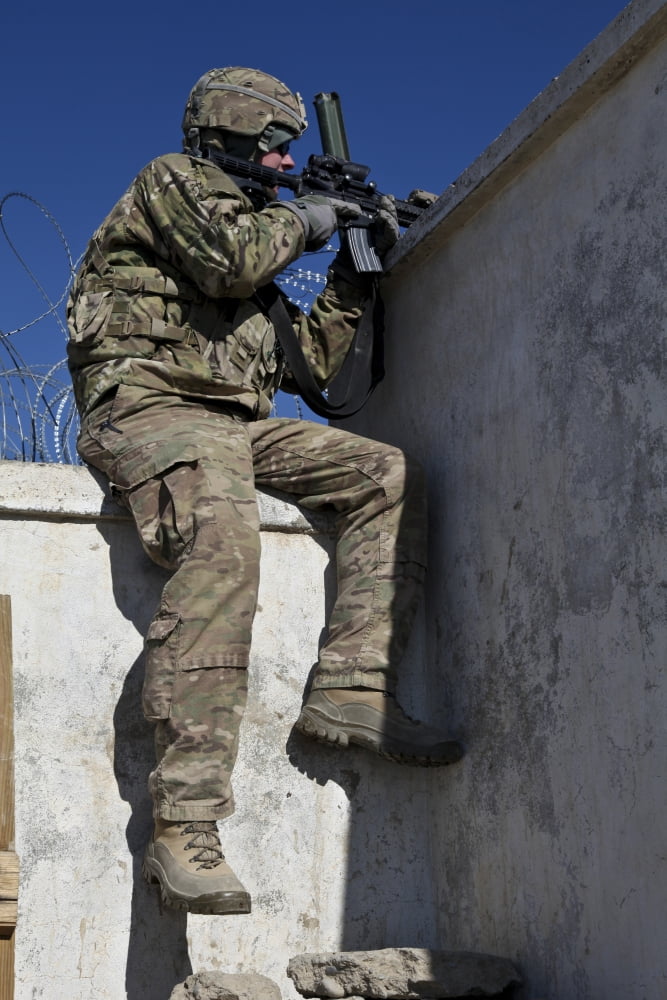 A US Soldier provides security at an outpost in Afghanistan Canvas Art - Stocktrek Images (23 x 35)