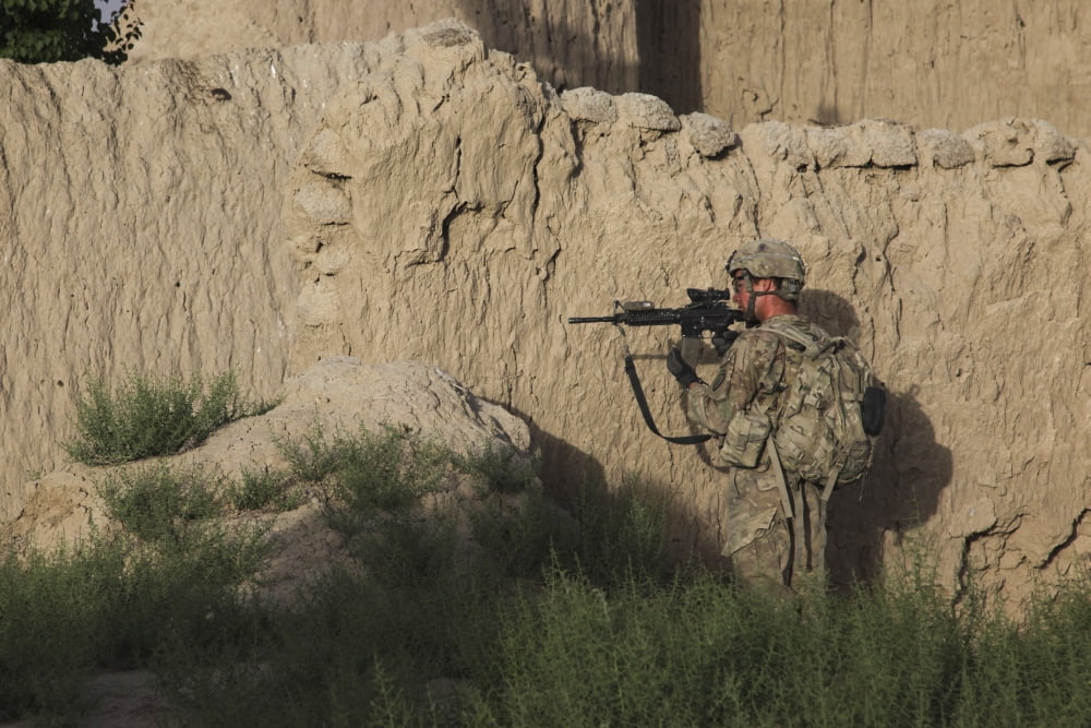 A US Soldier provides security during a patrol in Afghanistan Canvas Art - Stocktrek Images (35 x 23)