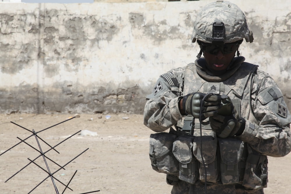 A US Soldier tests a tactical satellite radio Canvas Art - Stocktrek Images (34 x 23)
