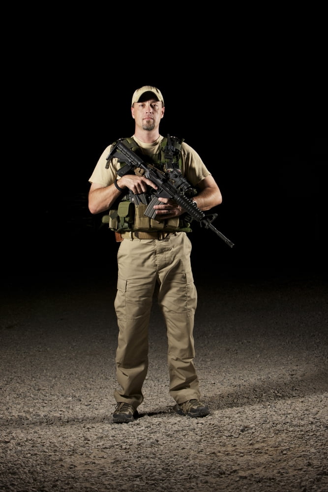 A US police officer contractor in Afghanistan Canvas Art - Terry MooreStocktrek Images (12 x 18)