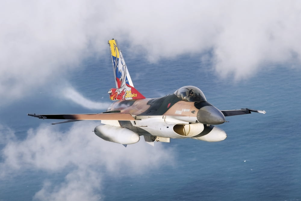 A Venezuelan Air Force F-16A flying over Brazil Canvas Art - Daniele FaccioliStocktrek Images (34 x 23)