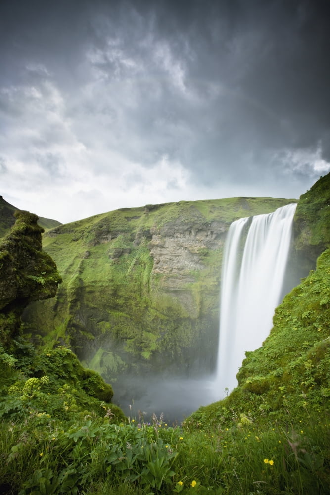 A Waterfall Over A Grassy Cliff Skogarfoss Iceland Canvas Art - David DuChemin Design Pics (12 x 19)