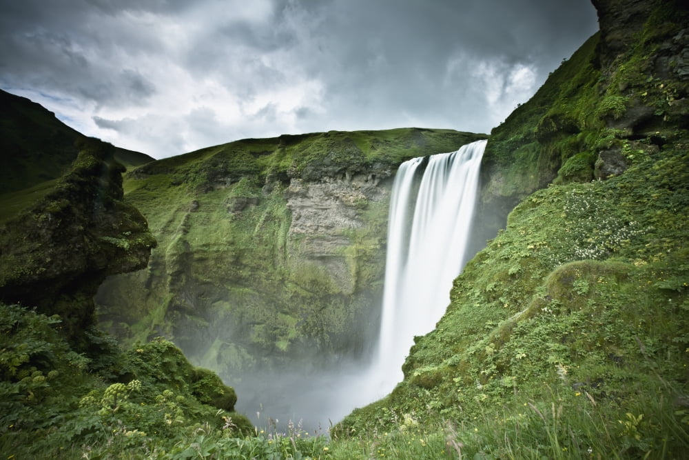 A Waterfall Over A Grassy Cliff Skogarfoss Iceland Canvas Art - David DuChemin Design Pics (19 x 12)