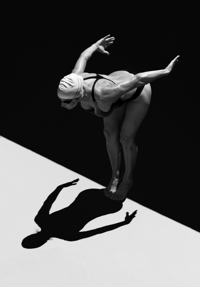 A Woman Prepares To Jump Backwards Off The Edge Of A Pool Into The Water Tarifa Cadiz Andalusia Spain Canvas Art - Ben Welsh Design Pics (24 x 36)