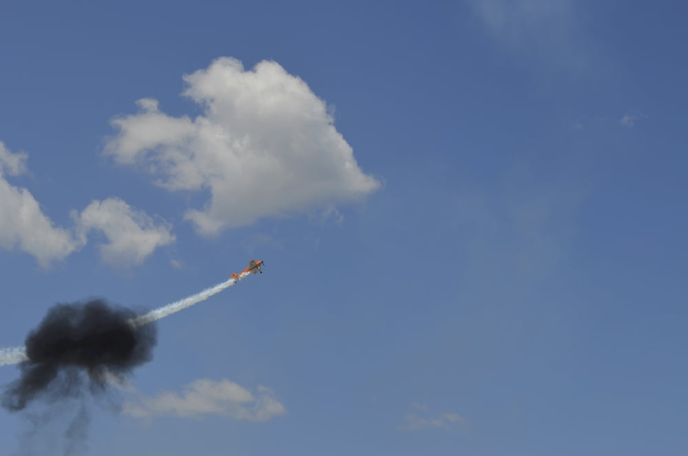 A Yakovlev Yak-55M aerobatic aircraft flys through a smoke ring Canvas Art - Stocktrek Images (35 x 23)