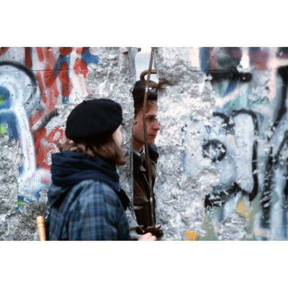 A Young West German Woman Speaks With An East German Guard Through An Opening In The Berlin Wall. Dec. 21 1989.