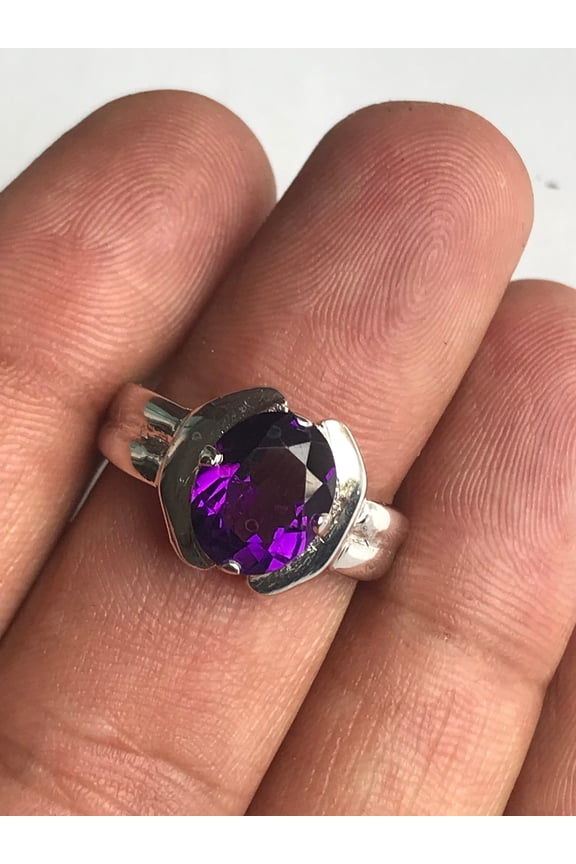 A beautiful ring is made in dark shade amethyst stone