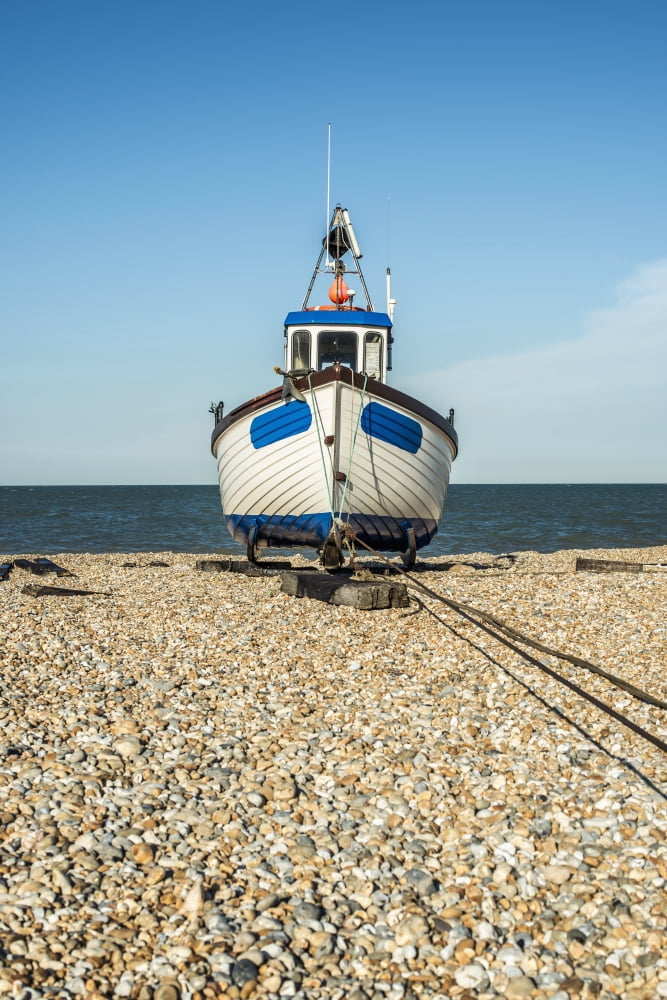 A boat on a shingle beach Dungeness Kent England Canvas Art - Dosfotos Design Pics (24 x 38)