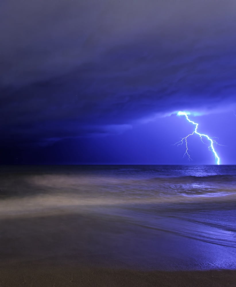 A bolt of lightning from an approaching storm in Miramar Argentina Canvas Art - Luis ArgerichStocktrek Images (13 x 16)