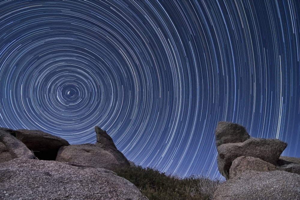 A boulder outcropping and star trails in Anza Borrego Desert State Park California Canvas Art - Dan BarrStocktrek Images (18 x 12)