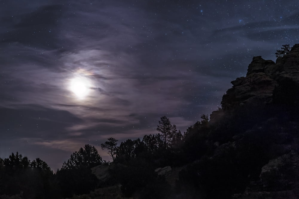 A bright moon rises through clouds over a hill in Oklahoma Canvas Art - John DavisStocktrek Images (35 x 23)