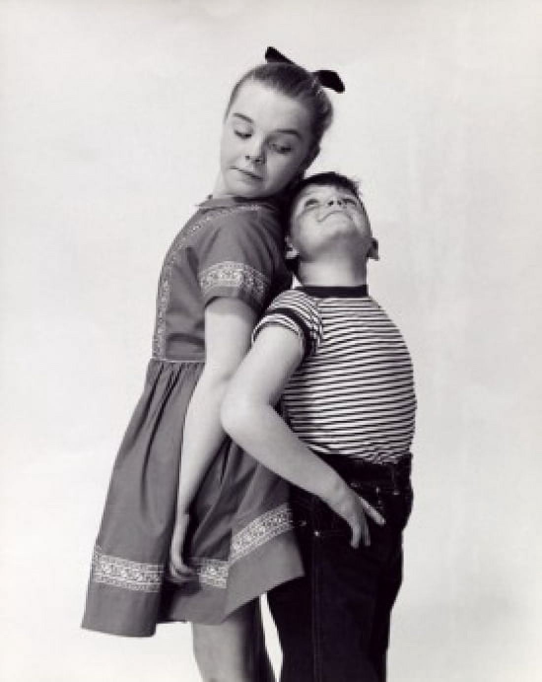 A brother and his sister comparing their height Canvas Art - (18 x 24)