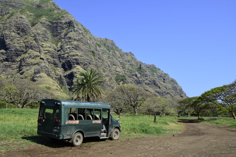 A bus parked on a trail along the Koolau Range in Oahu Hawaii Canvas Art - Ryan RossottoStocktrek Images (35 x 24)