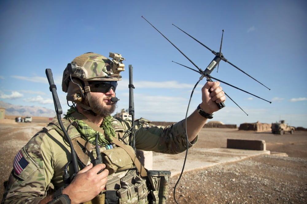 A coalition force member maintains communication during a security patrol Canvas Art - Stocktrek Images (35 x 23)