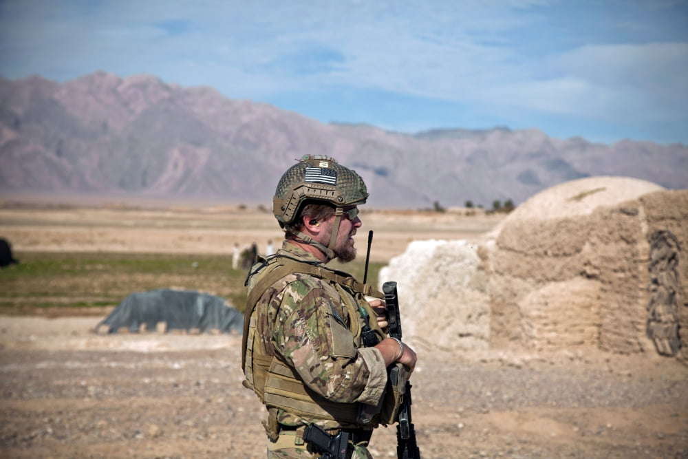 A coalition force member maintains security on the outskirts of an Afghan village Canvas Art - Stocktrek Images (35 x 23)