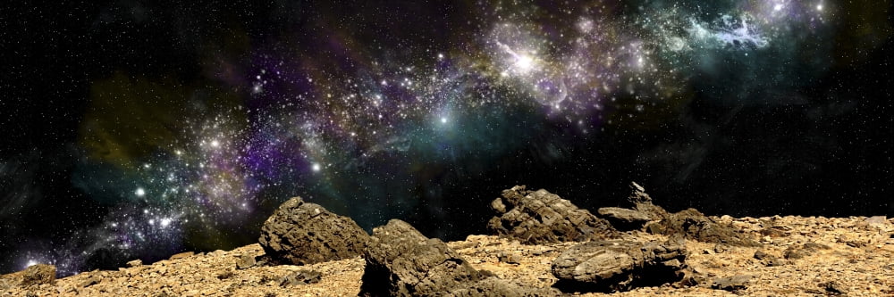A colorful nebula above a rocky and barren alien world Canvas Art - Marc WardStocktrek Images (24 x 8)