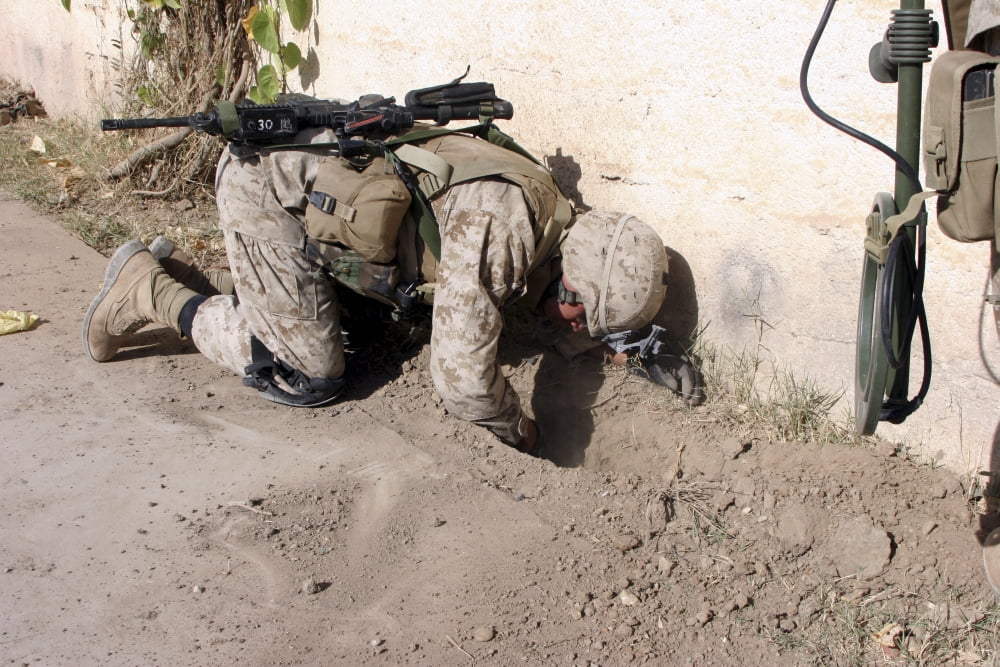 A combat engineer searches for weapons caches Canvas Art - Stocktrek Images (34 x 23)