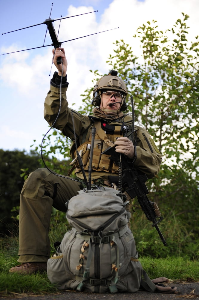 A combat rescue officer uses a man-pack radio Canvas Art - Stocktrek Images (23 x 34)